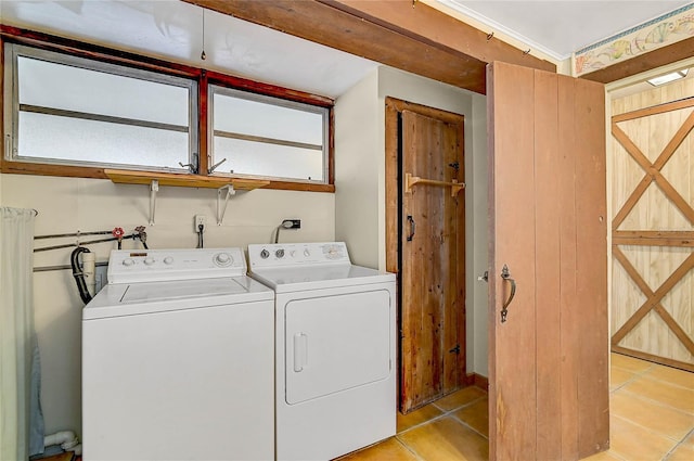 417 Shore Rd Unit A & B, Nokomis, FL 34275 - washroom with washer and clothes dryer and light tile patterned flooring