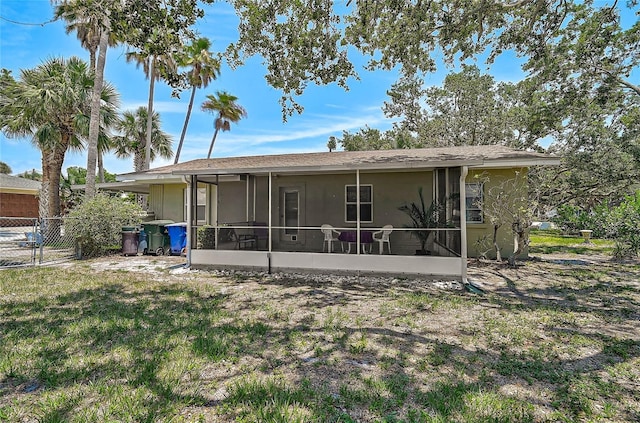 417 Shore Rd Unit A & B, Nokomis, FL 34275 - back of house featuring a sunroom and stucco siding