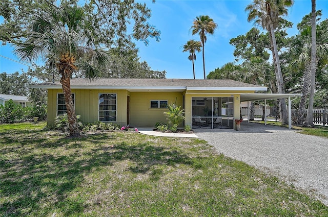 417 Shore Rd Unit A & B, Nokomis, FL 34275 - view of front of home featuring a sunroom and gravel driveway