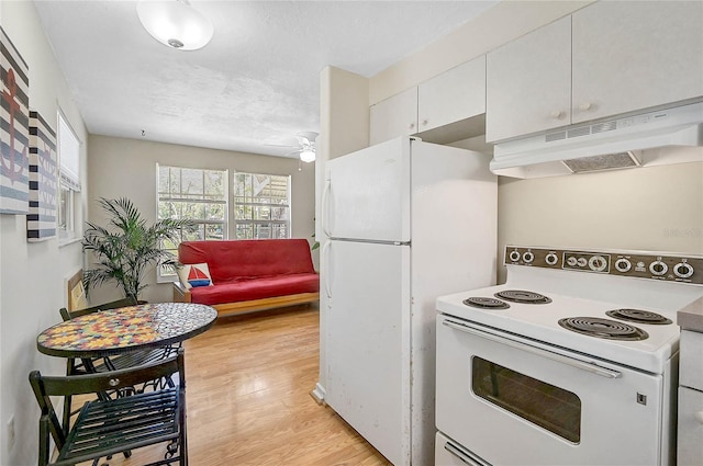 417 Shore Rd Unit A & B, Nokomis, FL 34275 - kitchen featuring under cabinet range hood, light wood-type flooring, white cabinets, white appliances, and ceiling fan