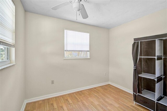 417 Shore Rd Unit A & B, Nokomis, FL 34275 - spare room with wood finished floors, baseboards, and ceiling fan