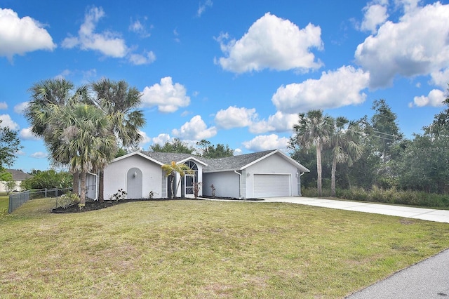 27416 Natal Dr, Punta Gorda, FL 33983 - ranch-style house featuring stucco siding, driveway, and a garage