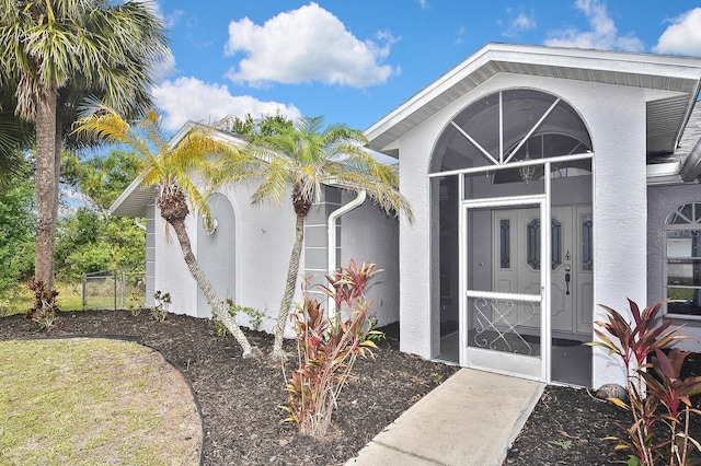 27416 Natal Dr, Punta Gorda, FL 33983 - property entrance featuring stucco siding