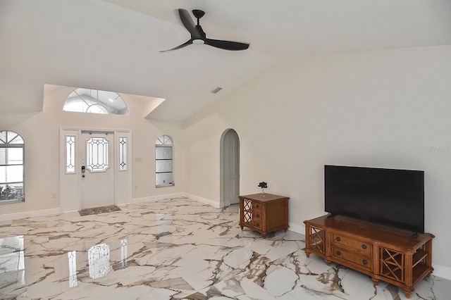 27416 Natal Dr, Punta Gorda, FL 33983 - entrance foyer featuring ceiling fan, arched walkways, high vaulted ceiling, baseboards, and light marble finish floors