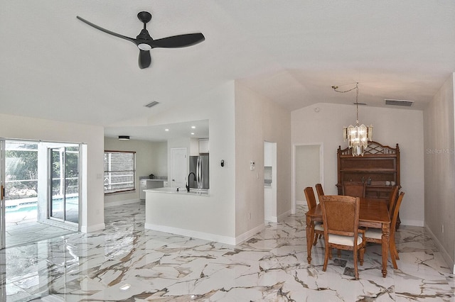 27416 Natal Dr, Punta Gorda, FL 33983 - dining room with vaulted ceiling, a chandelier, a ceiling fan, baseboards, and light marble finish floors