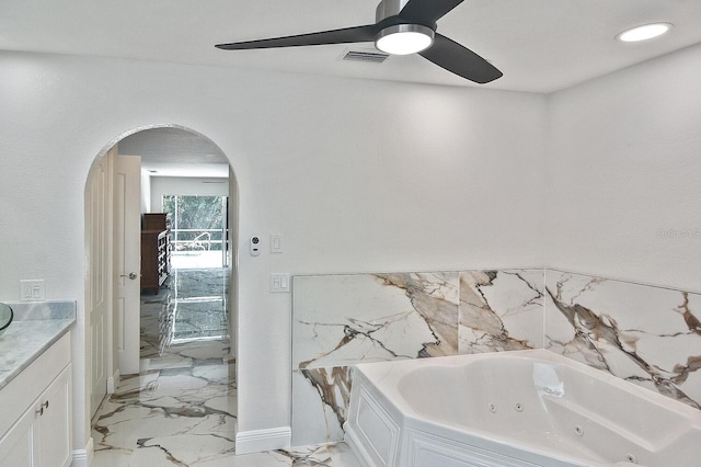 27416 Natal Dr, Punta Gorda, FL 33983 - full bathroom featuring a ceiling fan, a jetted tub, marble finish floors, and vanity