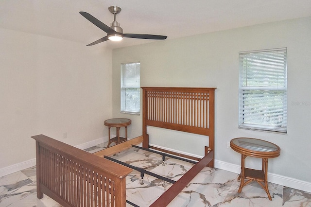 27416 Natal Dr, Punta Gorda, FL 33983 - bedroom featuring marble look tiles, multiple windows, baseboards, and ceiling fan
