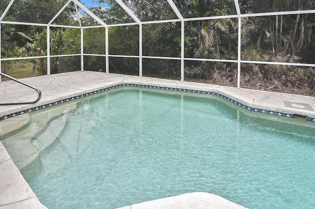 27416 Natal Dr, Punta Gorda, FL 33983 - swimming pool featuring a patio and glass enclosure