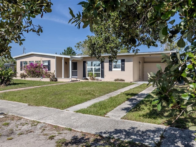 6231 Jordan St, North Port, FL 34287 - single story home with stucco siding, a front lawn, and an attached carport