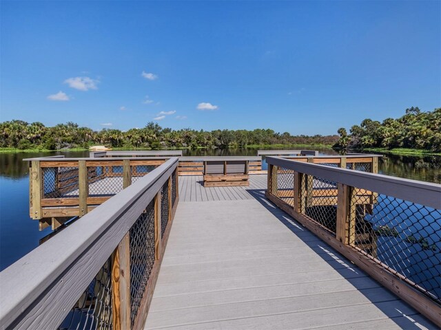 6231 Jordan St, North Port, FL 34287 - dock area with a water view and view of wooded area
