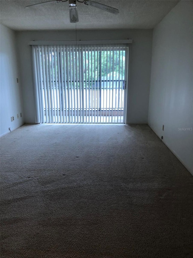 512 W Venice Ave Unit 205, Venice, FL 34285 - carpeted empty room featuring a textured ceiling and a ceiling fan
