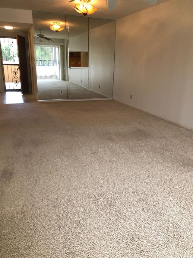 512 W Venice Ave Unit 205, Venice, FL 34285 - spare room with carpet and a ceiling fan