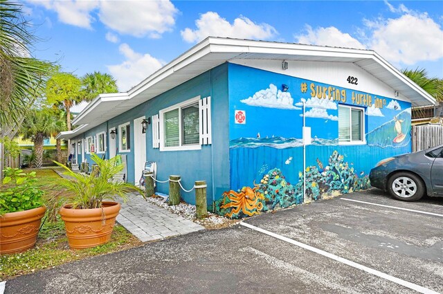 422 Polk Ave, Cape Canaveral, FL 32920 - view of front of house featuring uncovered parking