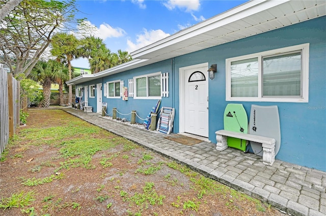 422 Polk Ave, Cape Canaveral, FL 32920 - view of exterior entry with stucco siding