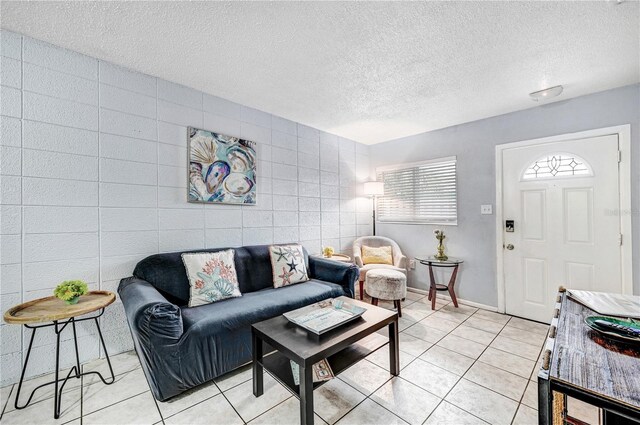 422 Polk Ave, Cape Canaveral, FL 32920 - living area featuring light tile patterned floors and a textured ceiling