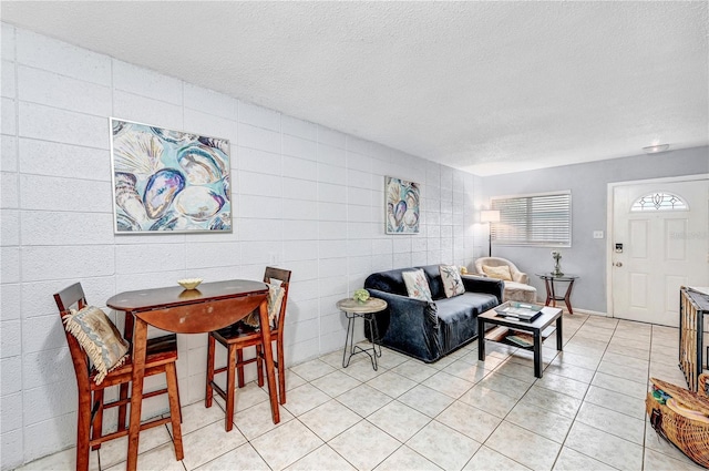 422 Polk Ave, Cape Canaveral, FL 32920 - living room with a textured ceiling and light tile patterned floors