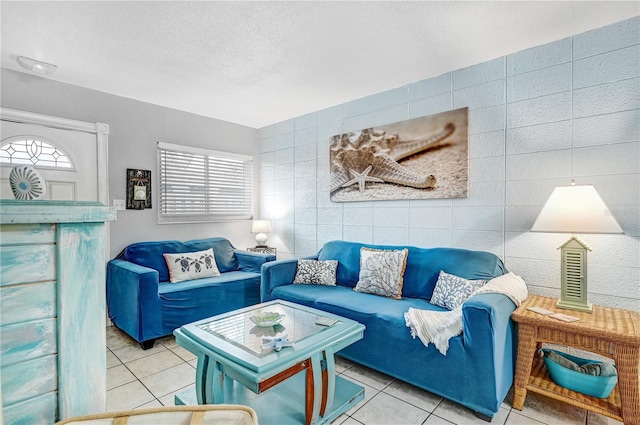 422 Polk Ave, Cape Canaveral, FL 32920 - living area featuring tile walls, tile patterned flooring, plenty of natural light, and a textured ceiling