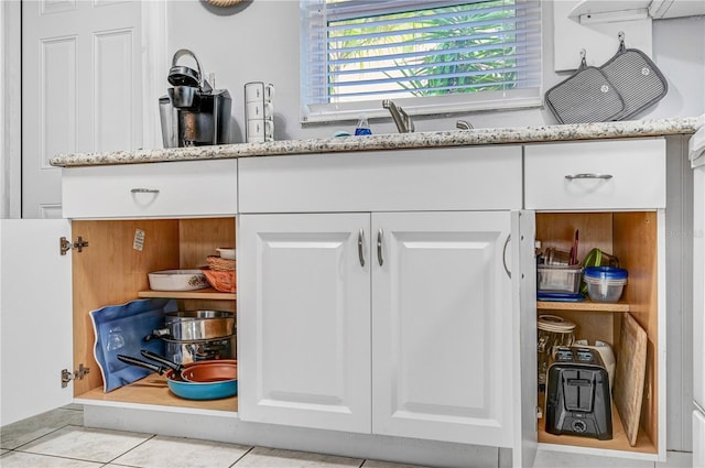 422 Polk Ave, Cape Canaveral, FL 32920 - kitchen view of white cabinetry and light stone counters