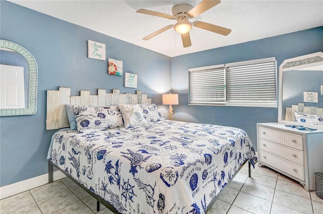422 Polk Ave, Cape Canaveral, FL 32920 - tiled bedroom featuring a textured ceiling and a ceiling fan