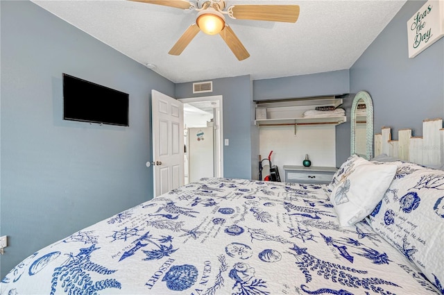 422 Polk Ave, Cape Canaveral, FL 32920 - bedroom featuring a ceiling fan, a closet, and a textured ceiling
