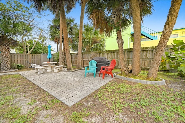 422 Polk Ave, Cape Canaveral, FL 32920 - fenced backyard with a patio area