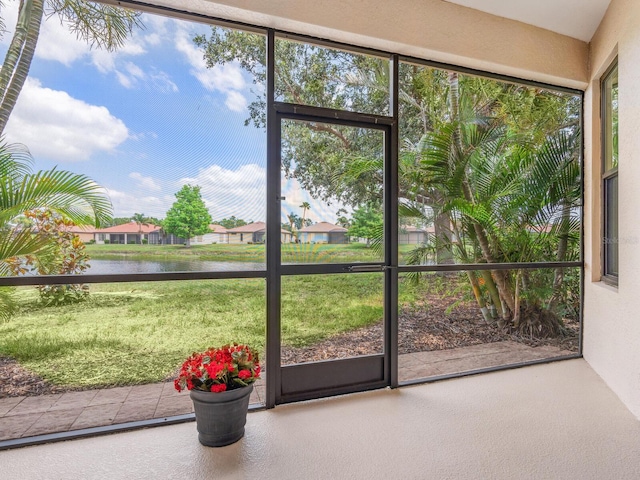 1493 Maseno Dr, Venice, FL 34292 - unfurnished sunroom featuring a water view