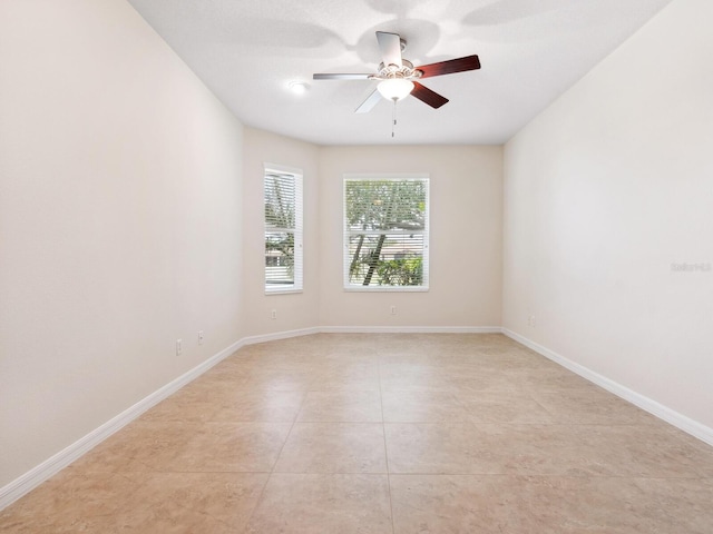 1493 Maseno Dr, Venice, FL 34292 - empty room with a ceiling fan, baseboards, and light tile patterned floors