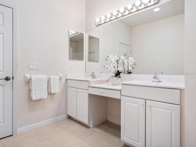 1493 Maseno Dr, Venice, FL 34292 - full bath with double vanity, tile patterned flooring, and baseboards
