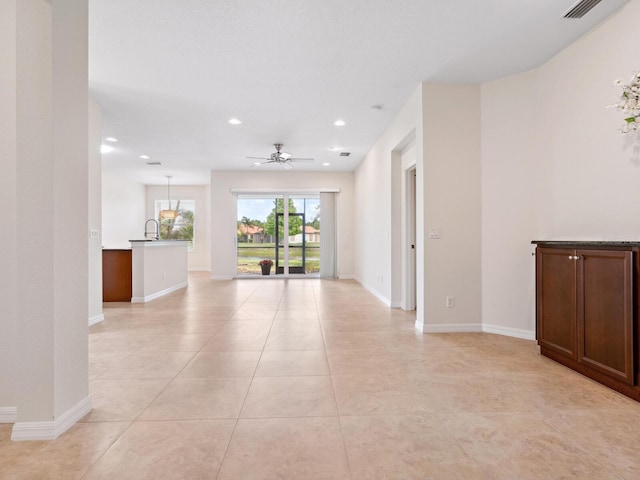 1493 Maseno Dr, Venice, FL 34292 - unfurnished room with recessed lighting, ceiling fan, light tile patterned flooring, and baseboards