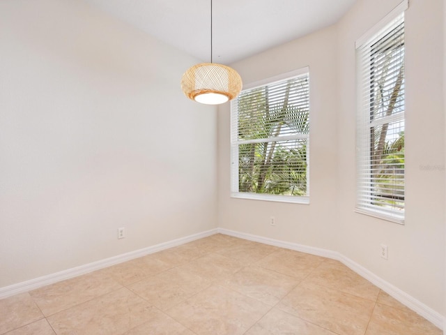 1493 Maseno Dr, Venice, FL 34292 - spare room with baseboards and light tile patterned floors