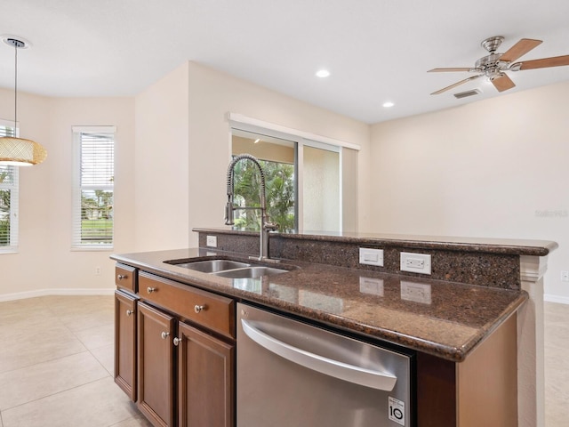 1493 Maseno Dr, Venice, FL 34292 - kitchen with stainless steel dishwasher, a sink, an island with sink, plenty of natural light, and recessed lighting
