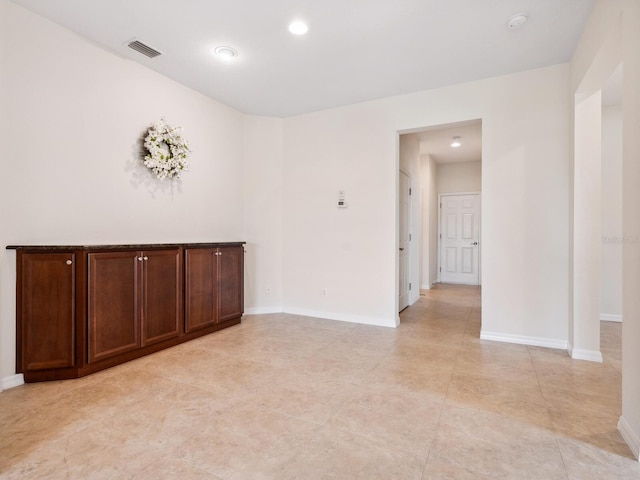 1493 Maseno Dr, Venice, FL 34292 - unfurnished room featuring a smoke detector, baseboards, and light tile patterned floors