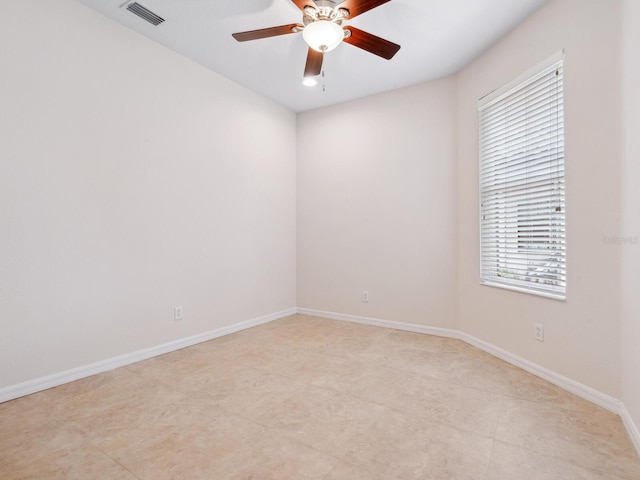 1493 Maseno Dr, Venice, FL 34292 - spare room with ceiling fan, baseboards, and light tile patterned floors