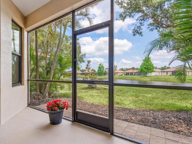 1493 Maseno Dr, Venice, FL 34292 - unfurnished sunroom featuring a water view and a textured wall