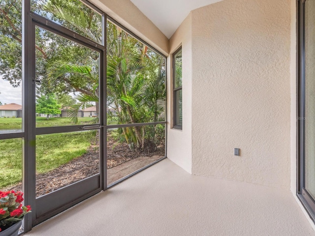 1493 Maseno Dr, Venice, FL 34292 - unfurnished sunroom with a textured wall and healthy amount of natural light