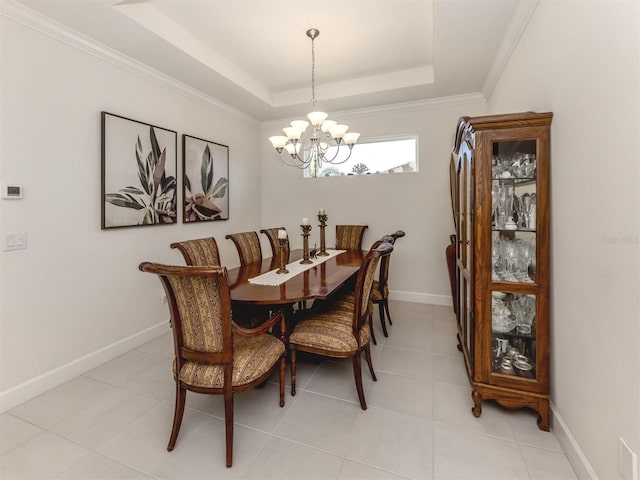5853 Semolino St, Nokomis, FL 34275 - dining room with a chandelier, a raised ceiling, light tile patterned flooring, baseboards, and crown molding