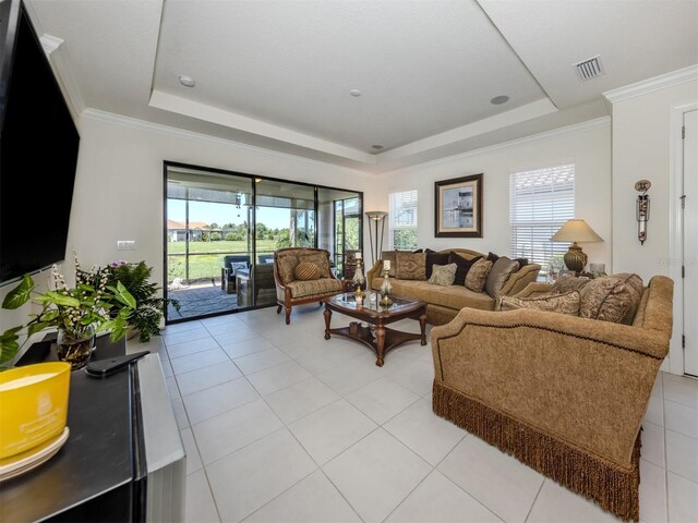 5853 Semolino St, Nokomis, FL 34275 - living room featuring a raised ceiling and light tile patterned flooring