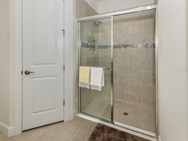 5853 Semolino St, Nokomis, FL 34275 - bathroom featuring a shower stall and tile patterned floors