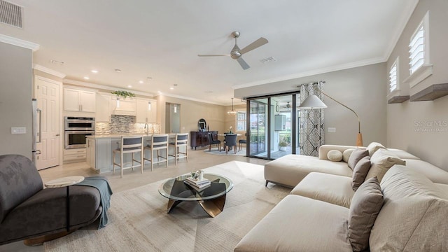 1481 Hyssop Loop, North Port, FL 34289 - living area featuring ceiling fan, plenty of natural light, crown molding, and recessed lighting