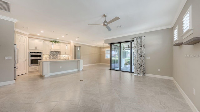1481 Hyssop Loop, North Port, FL 34289 - unfurnished living room featuring a ceiling fan, crown molding, plenty of natural light, baseboards, and light tile patterned floors