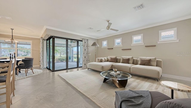 1481 Hyssop Loop, North Port, FL 34289 - living room featuring crown molding, plenty of natural light, baseboards, and ceiling fan