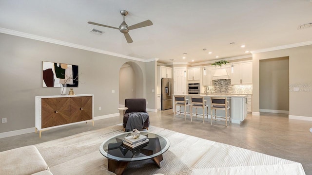 1481 Hyssop Loop, North Port, FL 34289 - living room with arched walkways, ornamental molding, a ceiling fan, recessed lighting, and baseboards