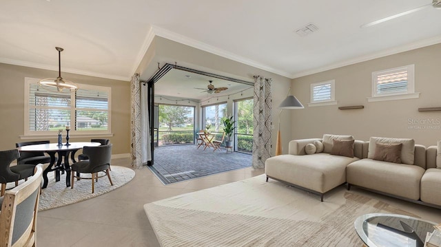 1481 Hyssop Loop, North Port, FL 34289 - living area featuring plenty of natural light, light tile patterned floors, crown molding, and baseboards