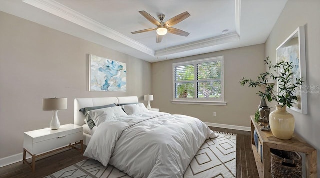 1481 Hyssop Loop, North Port, FL 34289 - bedroom featuring a raised ceiling, wood finished floors, baseboards, crown molding, and a ceiling fan