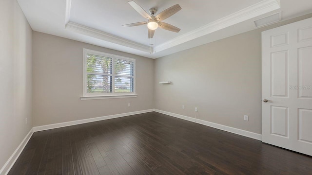 1481 Hyssop Loop, North Port, FL 34289 - empty room with ornamental molding, a ceiling fan, a raised ceiling, dark wood-style floors, and baseboards