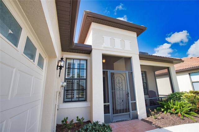1438 Maseno Dr, Venice, FL 34292 - view of exterior entry featuring stucco siding