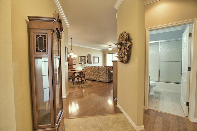 1438 Maseno Dr, Venice, FL 34292 - corridor with crown molding, light tile patterned flooring, and baseboards