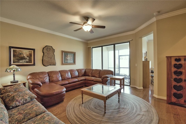 1438 Maseno Dr, Venice, FL 34292 - living area featuring a ceiling fan, wood finished floors, ornamental molding, baseboards, and a textured ceiling