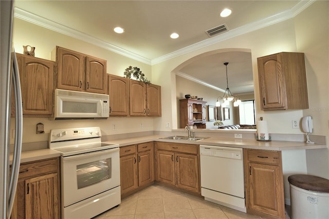 1438 Maseno Dr, Venice, FL 34292 - kitchen with white appliances, a sink, ornamental molding, light tile patterned floors, and brown cabinetry
