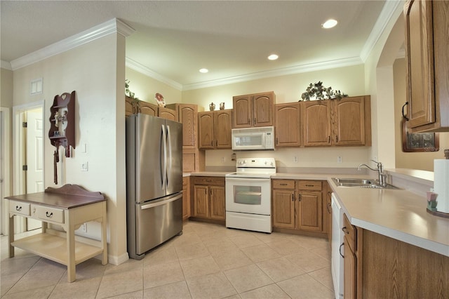 1438 Maseno Dr, Venice, FL 34292 - kitchen with white appliances, a sink, brown cabinetry, light tile patterned floors, and ornamental molding
